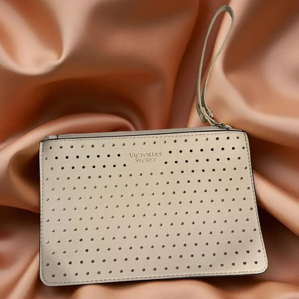 🛍️ Victoria's Secret Cream pinkish cut out Perforated zip Wristlet medium